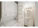 Bathroom featuring a stacked washer/dryer unit and vanity with a mirror and modern lighting at 6357 Bahia Del Mar Blvd # 403, St Petersburg, FL 33715