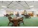 Welcoming common area features cozy wicker tables and chairs, and bar for relaxation and socializing at 6357 Bahia Del Mar Blvd # 403, St Petersburg, FL 33715