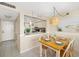 View of the dining area and kitchen, showcasing open-concept living at 6357 Bahia Del Mar Blvd # 403, St Petersburg, FL 33715