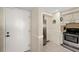 Entry with kitchen featuring stainless appliances and cream cabinets at 6357 Bahia Del Mar Blvd # 403, St Petersburg, FL 33715