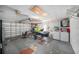 Spacious garage with jet ski, laundry area, and ample storage at 7136 Isle Dr, Port Richey, FL 34668