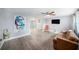 Spacious living room with luxury vinyl flooring and a modern ceiling fan at 7136 Isle Dr, Port Richey, FL 34668