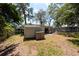 Backyard with a shed and a patio area at 7339 Royal Palm Dr, New Port Richey, FL 34652