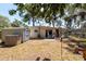 Spacious backyard with a small storage shed, and patio area for outdoor relaxation at 7339 Royal Palm Dr, New Port Richey, FL 34652