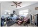 Bedroom featuring a ceiling fan, two windows, and neutral paint at 7339 Royal Palm Dr, New Port Richey, FL 34652