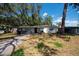 Charming single-story home with a well-maintained front yard and mature trees at 7339 Royal Palm Dr, New Port Richey, FL 34652