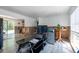 Spacious living area with tile flooring, and view to the back yard at 7339 Royal Palm Dr, New Port Richey, FL 34652