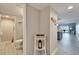 Hallway leading to a bathroom, kitchen, and living area at 7700 Sun Island S Dr # 107, South Pasadena, FL 33707