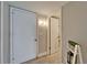 Hallway featuring a front door and access to bathroom at 7700 Sun Island S Dr # 107, South Pasadena, FL 33707