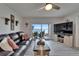 Bright living room with sliding doors to the outdoor patio and scenic water views at 7700 Sun Island S Dr # 107, South Pasadena, FL 33707
