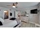 Bright bedroom with ensuite bath, modern furnishings, and a ceiling fan at 7700 Sun Island S Dr # 107, South Pasadena, FL 33707