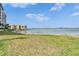 A view of the water from the grassy common area next to The Commodore 7700 at 7700 Sun Island S Dr # 107, South Pasadena, FL 33707