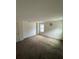 Bright bedroom with carpet, neutral walls, and a window at 8273 Artisan Way, Seminole, FL 33777