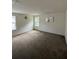 Large bedroom featuring carpet, neutral walls, and natural light at 8273 Artisan Way, Seminole, FL 33777