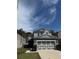Charming two-story home with well-manicured lawn and a two-car garage at 8273 Artisan Way, Seminole, FL 33777