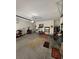 Spacious garage with concrete floor, storage shelves, and overhead door system at 8273 Artisan Way, Seminole, FL 33777