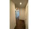 Hallway with carpeted floors and access to multiple rooms, providing a sense of flow at 8273 Artisan Way, Seminole, FL 33777