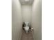 Cozy toilet room with standard toilet, neutral tile flooring, and minimalist design at 8273 Artisan Way, Seminole, FL 33777
