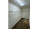 Empty walk-in closet with carpet and wire shelving at 8273 Artisan Way, Seminole, FL 33777