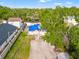 Overhead angle shows the property's yard and surrounding greenery, offering a sense of privacy at 8615 Jackson Springs Rd, Tampa, FL 33615