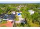 Aerial view showing the location of the home among trees and other residential buildings at 8615 Jackson Springs Rd, Tampa, FL 33615