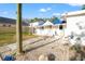 Exterior of home on a sunny day, set on a gravel lot with a walkway made of stepping stones at 8615 Jackson Springs Rd, Tampa, FL 33615