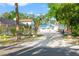 This shows a view of the property featuring a spacious driveway leading to the house and fenced yard at 8615 Jackson Springs Rd, Tampa, FL 33615