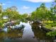 Image shows the property's access to a tranquil waterway, ideal for nature lovers and boaters at 8615 Jackson Springs Rd, Tampa, FL 33615