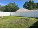 Spacious backyard with a white vinyl fence, offering privacy at 8804 Briar Hollow Ct, Tampa, FL 33634
