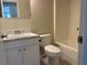 Bathroom featuring a shower and tub combo with a white vanity at 8804 Briar Hollow Ct, Tampa, FL 33634