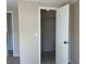 A bedroom closet with white door and trim, revealing storage space with shelves at 8804 Briar Hollow Ct, Tampa, FL 33634