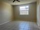 A spacious bedroom features a ceiling fan and a large window at 8804 Briar Hollow Ct, Tampa, FL 33634
