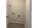 Laundry room with connections and laminate flooring for easy cleaning at 8804 Briar Hollow Ct, Tampa, FL 33634