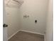 Laundry room with connections and laminate flooring for easy cleaning at 8804 Briar Hollow Ct, Tampa, FL 33634