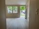 Bright living room with modern floors and fresh, neutral walls, capturing a welcoming atmosphere at 8804 Briar Hollow Ct, Tampa, FL 33634