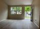 A living room with an exterior view through windows at 8804 Briar Hollow Ct, Tampa, FL 33634