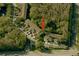 Aerial view of townhouses surrounded by lush greenery; great location at 8901 Casablanca Way, Tampa, FL 33626