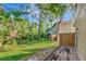 Spacious backyard with lush lawn and a wood deck at 8901 Casablanca Way, Tampa, FL 33626