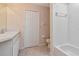 Bright bathroom with white tiled shower and storage at 8901 Casablanca Way, Tampa, FL 33626