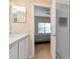 Bathroom featuring a walk-in shower, single vanity and a doorway to the bedroom at 8901 Casablanca Way, Tampa, FL 33626