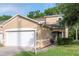 Charming two-story townhome with a well-maintained lawn and attached two-car garage at 8901 Casablanca Way, Tampa, FL 33626