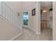Foyer showcasing staircase and entryway, flowing to breakfast nook, complete with hardwood floors at 8901 Casablanca Way, Tampa, FL 33626