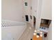 Bright foyer with an open floor plan, staircase, and views of the dining room and kitchen at 8901 Casablanca Way, Tampa, FL 33626