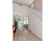 Bright foyer featuring high ceilings, staircase, and seamless flow to the living spaces at 8901 Casablanca Way, Tampa, FL 33626