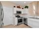 Well-equipped kitchen with stainless steel appliances, modern fixtures, and laminate flooring at 8901 Casablanca Way, Tampa, FL 33626