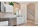 Efficient kitchen featuring stainless steel dishwasher, white cabinets, and an undermount sink at 8901 Casablanca Way, Tampa, FL 33626