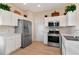 Well-lit kitchen with stainless steel appliances, sleek countertops, and ample cabinet space at 8901 Casablanca Way, Tampa, FL 33626