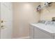 Laundry room featuring a side-by-side washer and dryer and wire shelving at 8901 Casablanca Way, Tampa, FL 33626