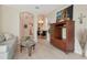 Bright living room features light wood flooring, comfortable seating, and an open floorplan to the dining area at 8901 Casablanca Way, Tampa, FL 33626