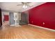 Primary bath with glass walk in shower, hardwood flooring, and vessel sink at 9130 Dresden Ln, Port Richey, FL 34668